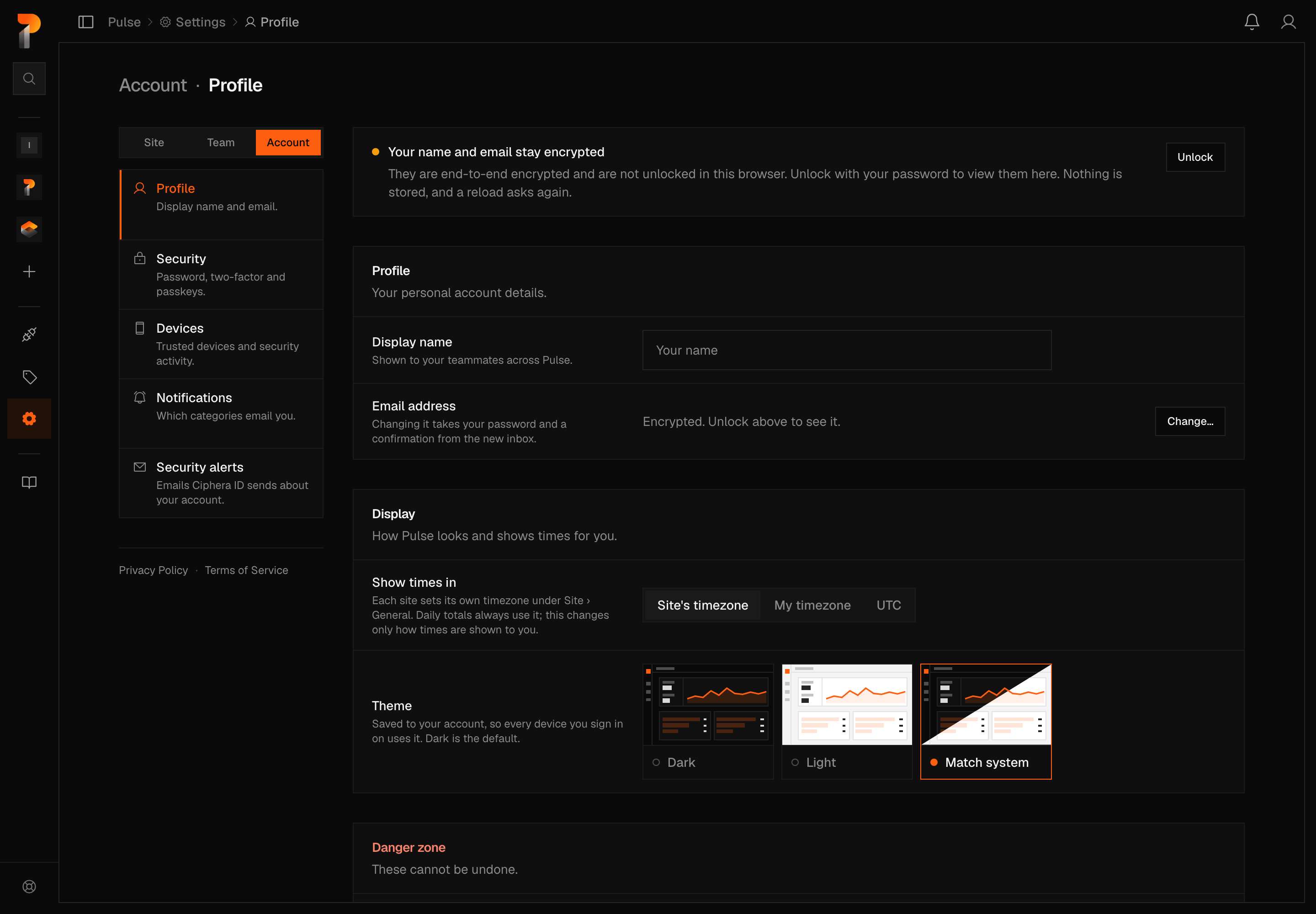 The Account Profile settings page, with Account selected in the Site, Team, Account switcher: a callout explaining that name and email stay encrypted, with an Unlock button, above an editable but empty Display name field and an Email address field showing as encrypted with a Change button. Below that, a Display panel shows a Show times in switcher set to Site's timezone and a Theme picker with Dark, Light and Match system options, Match system selected, plus a closed Danger zone section at the bottom.